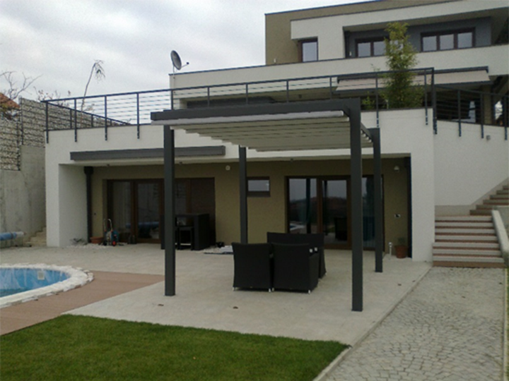 Pergolas for Private Homes and Pool Decks pergola awning in the back of a house by the pool area